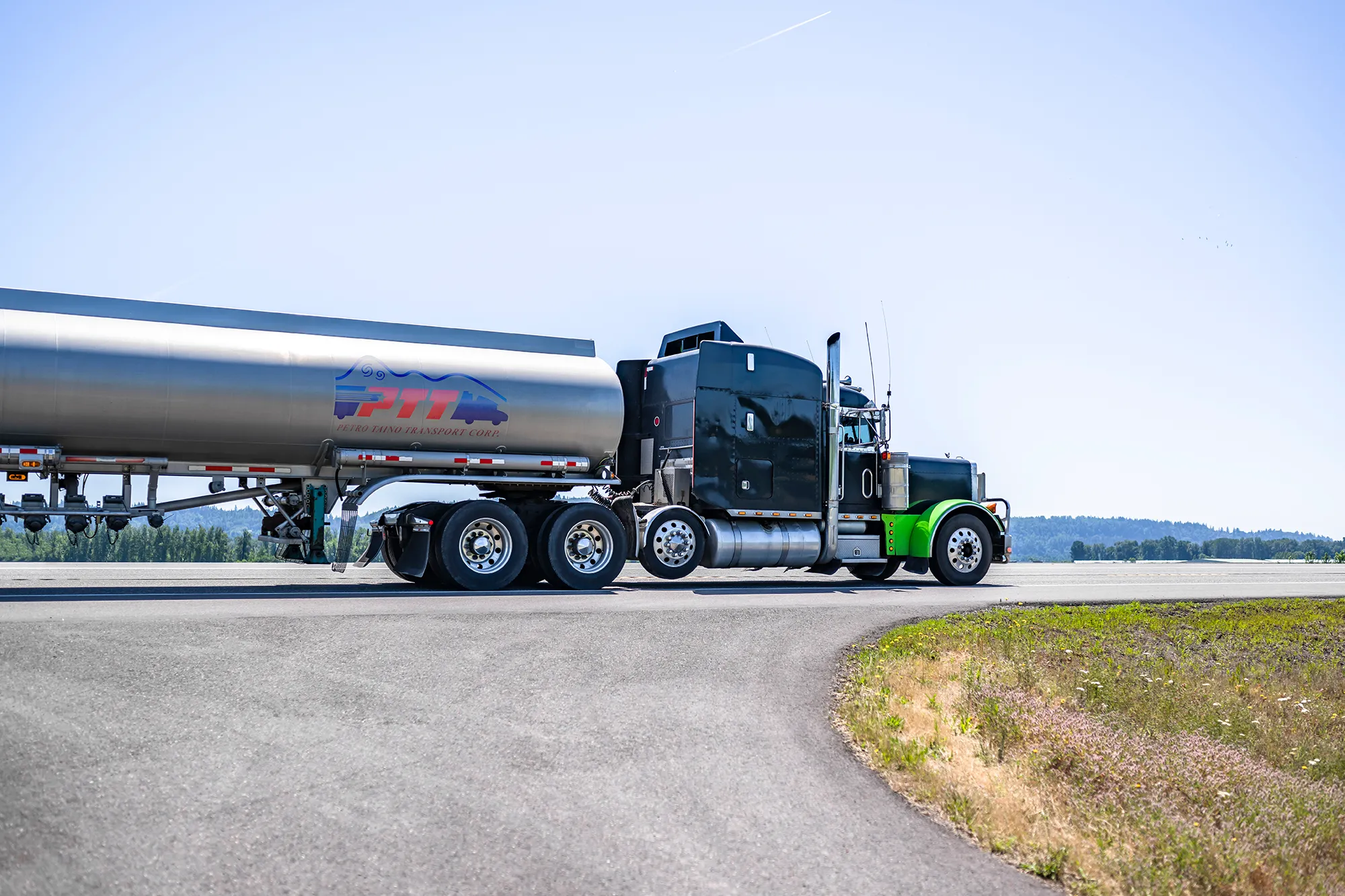 Petro Taino branded truck driving down road