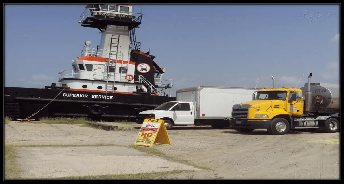 Marine Ship next to trucks